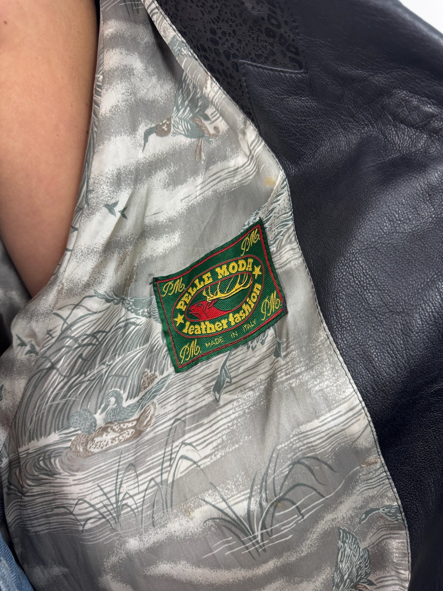 GIACCA IN PELLE CON DETTAGLI IN MACULATO